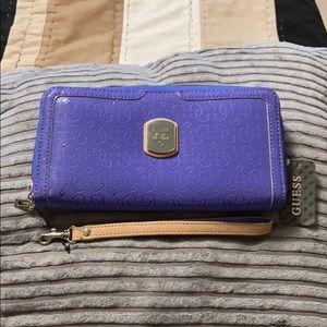 Guess Blue Wallet as per price tag. Looks Lilac !